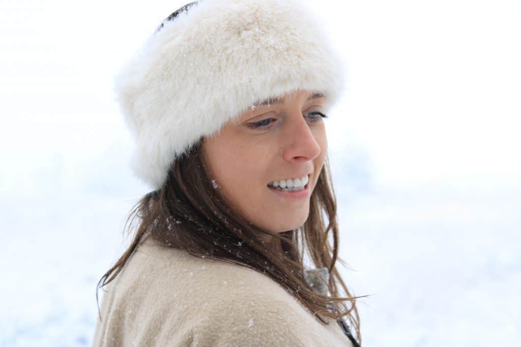 Snowy portrait of a girl with a furry hair band on 