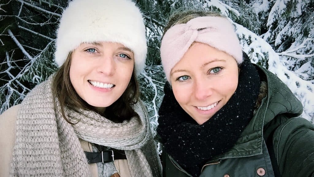 Selfie of two girls with hair bands on smiling in the camera