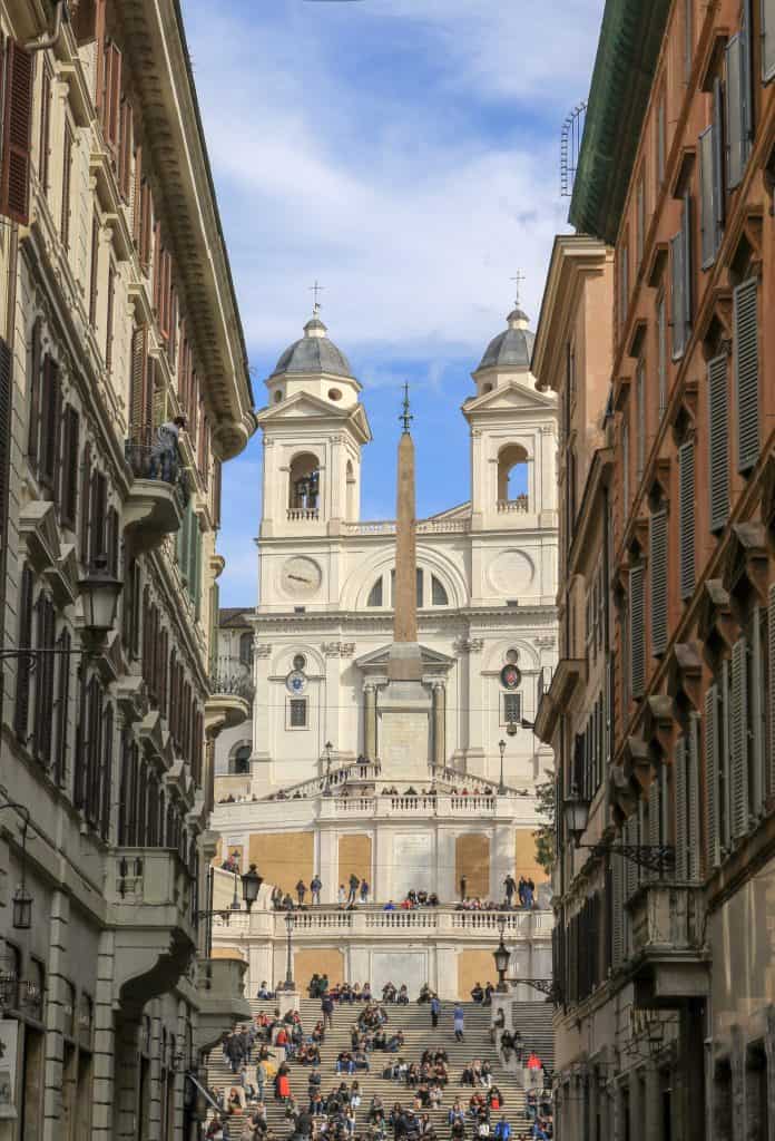 Spanish steps with people on it and houses on the left and right