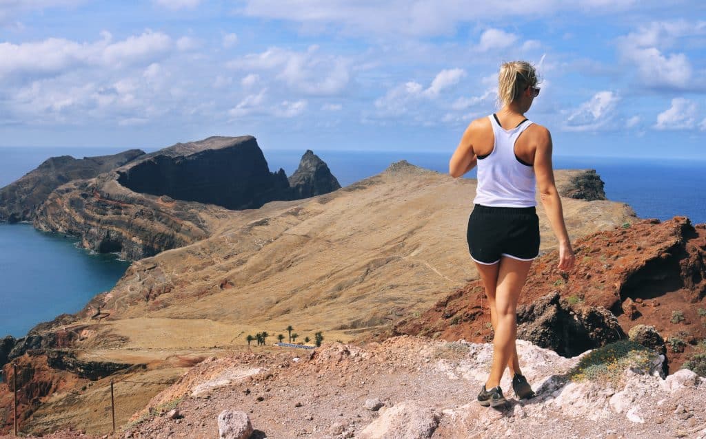 Girl standing on the top spot of the hike Ponte De Sao Lourenco Madeira