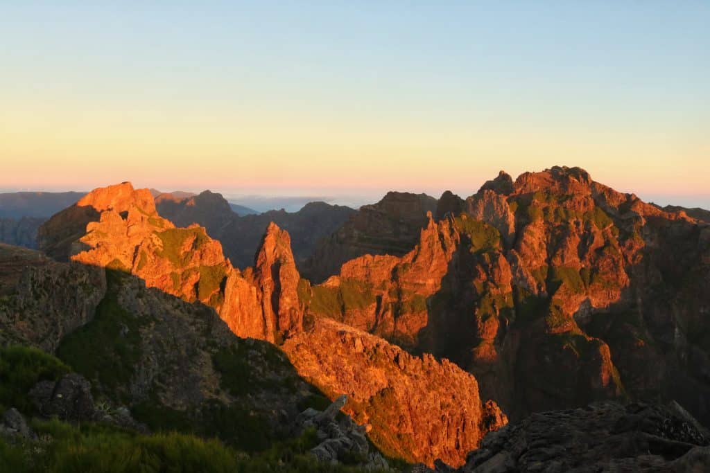 Sunrise that makes the light shine partly on mountain tops