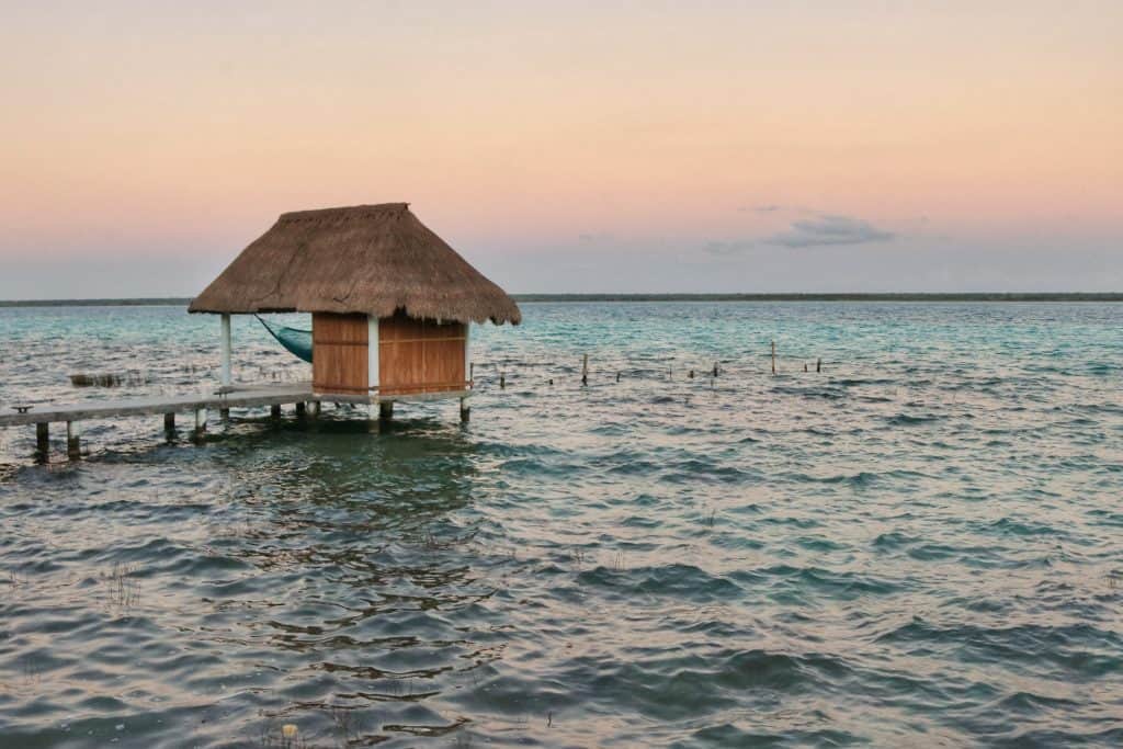 Sunset over a lagoon with a pink sky