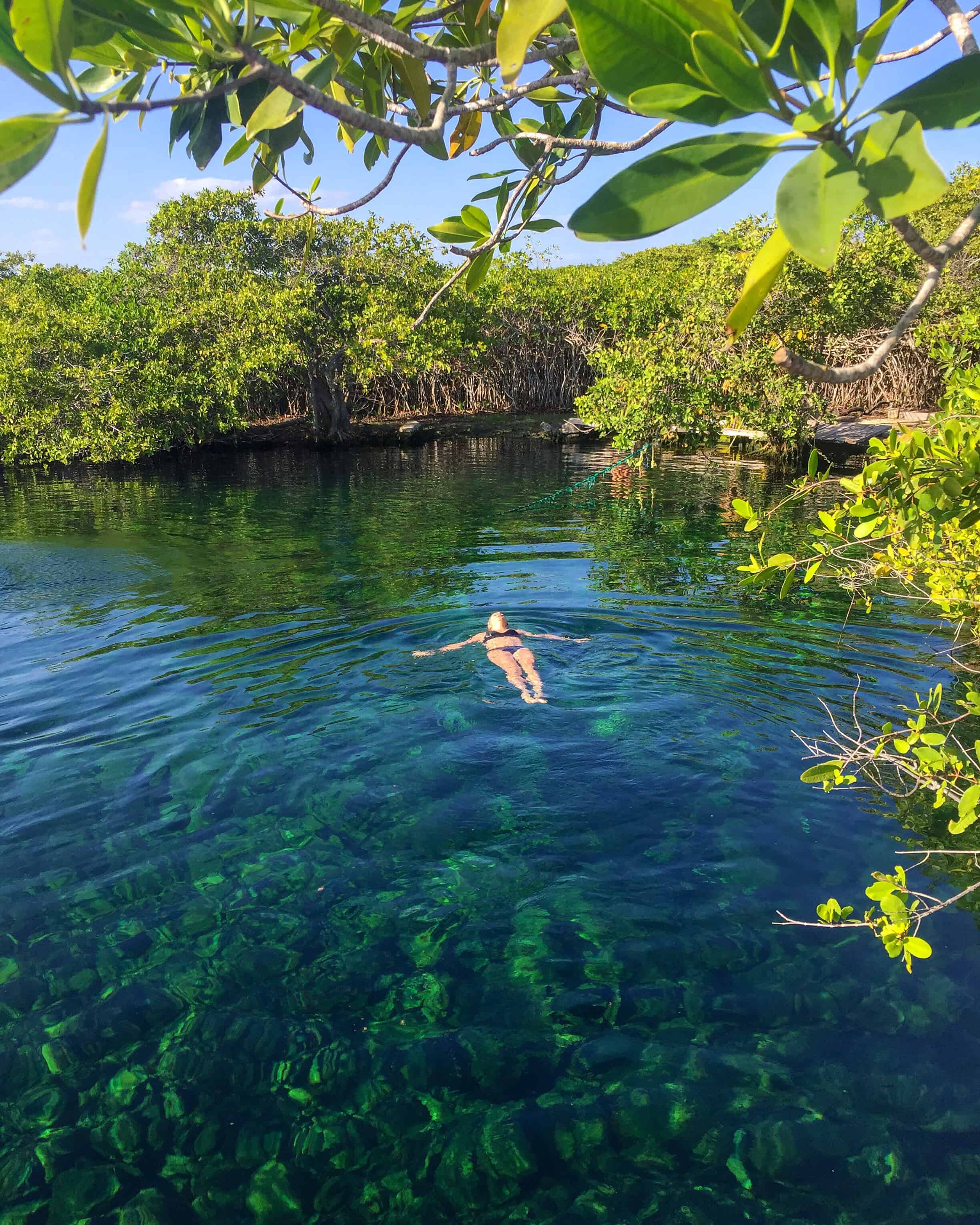 Girl in cenote Cape-Ha Tulum