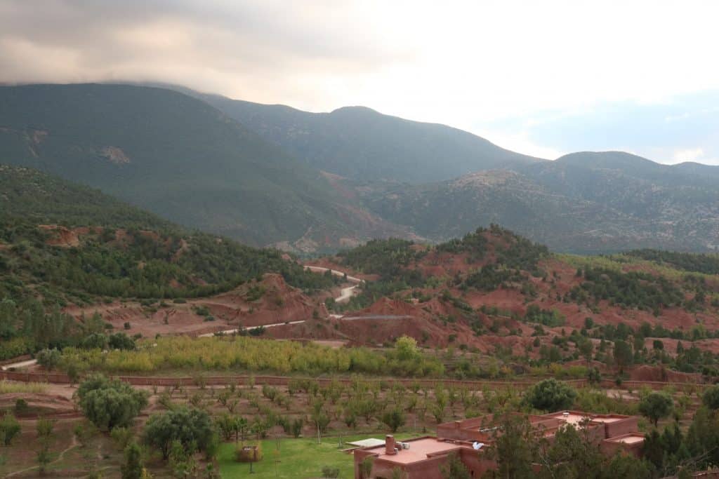 Mountains, an orange building and a lot of trees