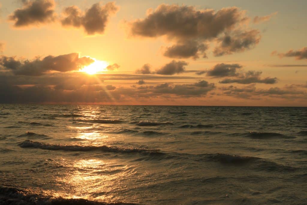 Sunset over the ocean with an orange sky