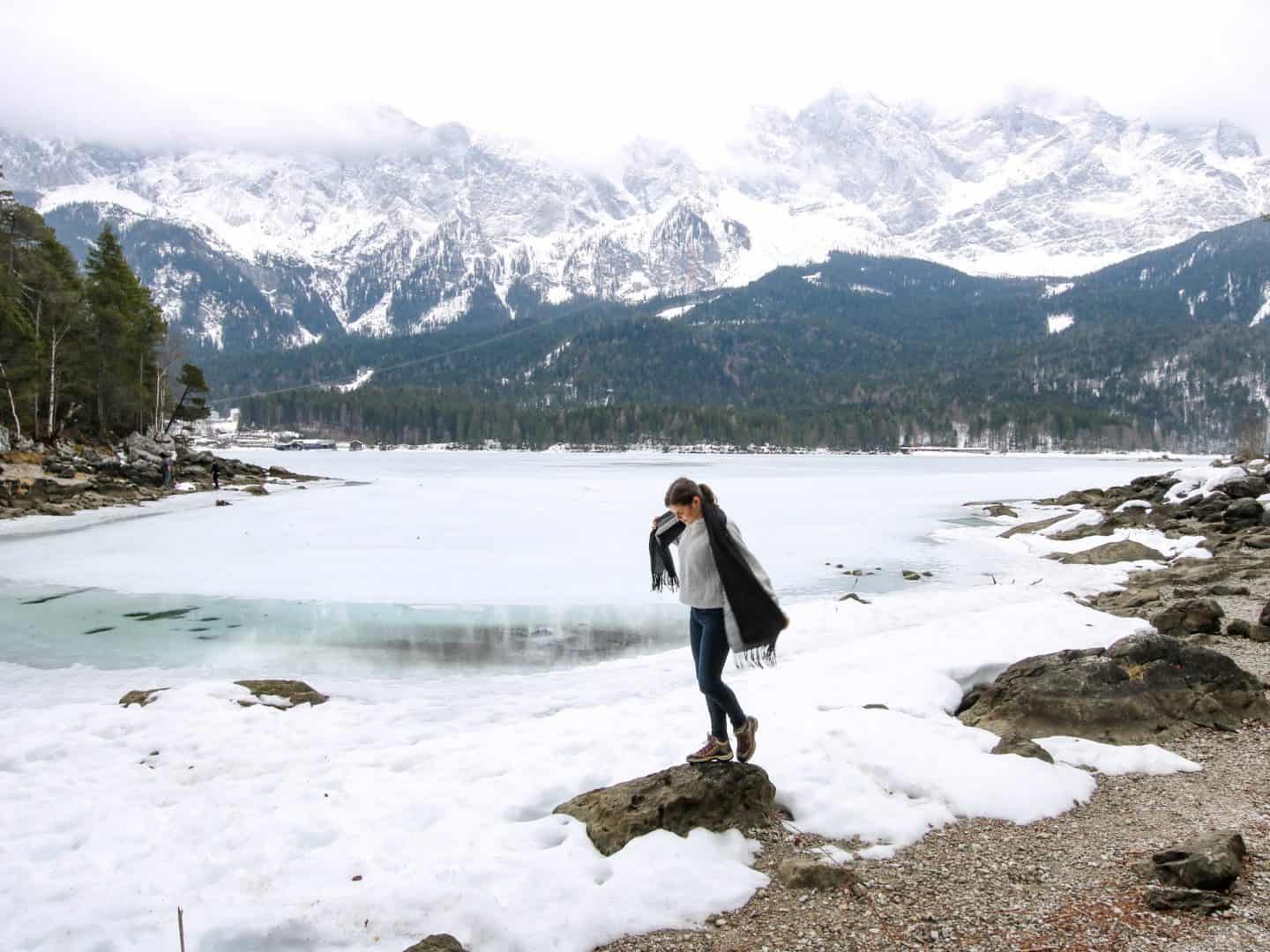 Girl in front of a frozen lake Eibsee